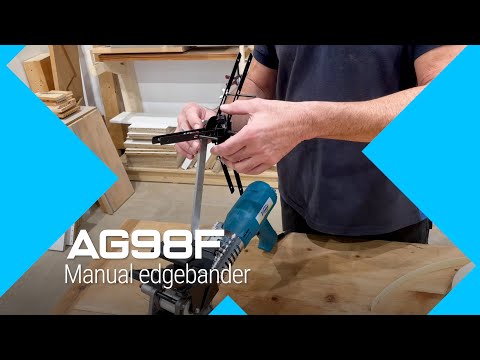 Virutex Hand-Held Hot Air Edgebander AG98F 120V 5200299 in use applying edge banding with precision tracking on panel edge